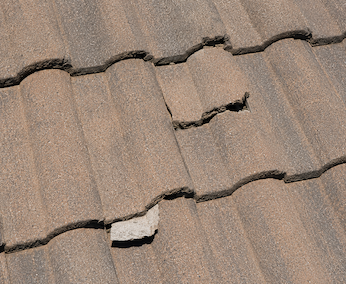 Two additional damaged tiles on south slope
